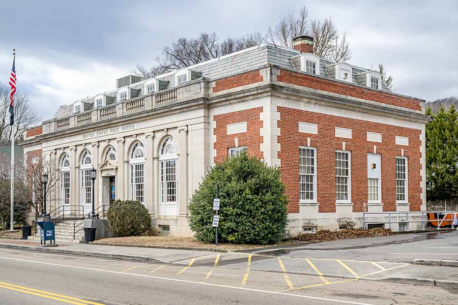 Rogersville TN Insurance - Rogersville United States Post Office building on a Partly Couldy Day